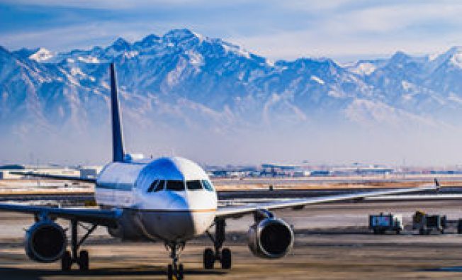 Beautiful view of the snow covered mountains from Salt Lake City whilst in the airport lounge getting ready for departure during winter.